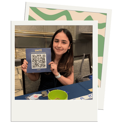 Photo in a polaroid frame of Unité, a mental health initiative by and for Gen Z, at the 2023 Active Minds Conference. A second polaroid photo behind the main photo has a green and beige pattern.