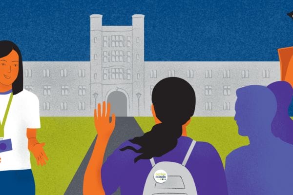 A tour guide on a college campus is speaking to a student in a group with their hand raised. The student is wearing a backpack with an Active Minds pin on the top.