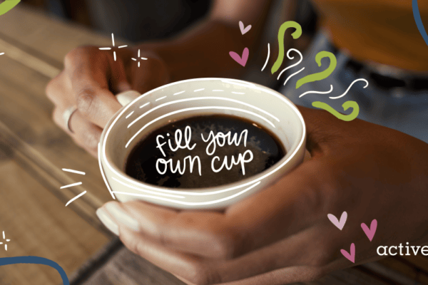 Image of a person holding a coffee cup with words inside the cup reading, 