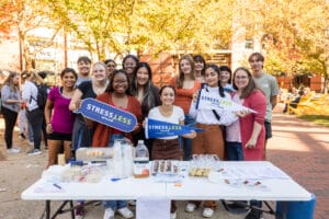 Students gathered holding signs that read 