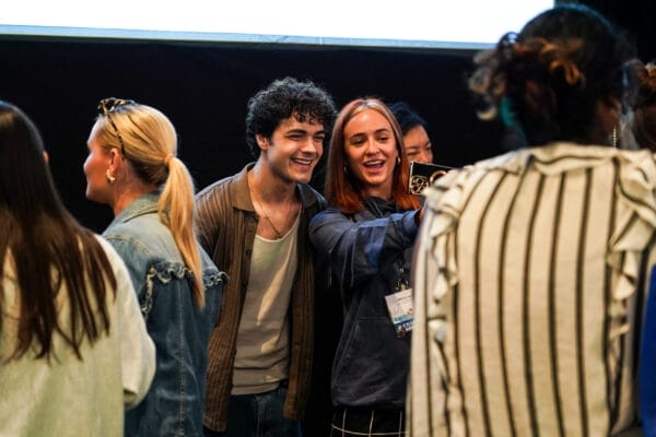 Alexander Stewart poses with a young person taking a selfie while at the Active Minds Conference.