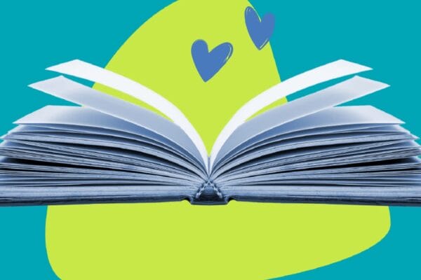 Open book on colorful background with illustrated hearts