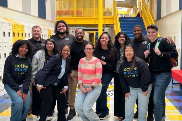 Active Minds staff and Central City Value High School representative pose for group photo