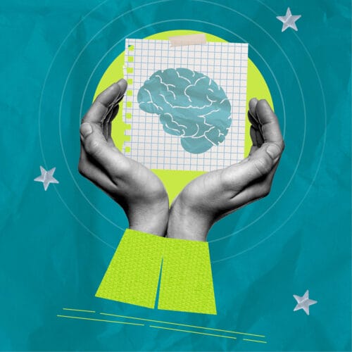 Hands holding a paper with a brain illustration, symbolizing mindful digital wellbeing.