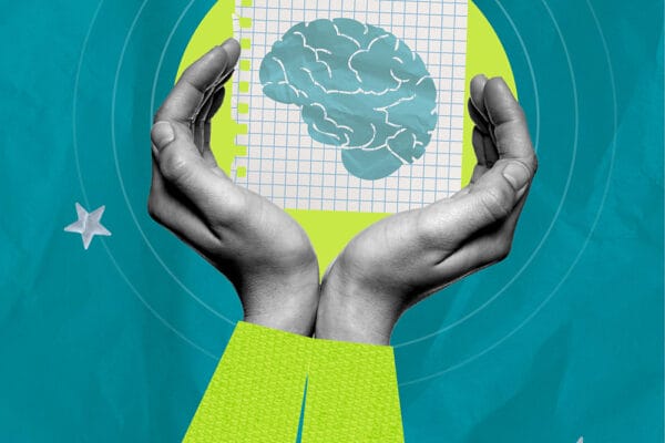 Hands holding a paper with a brain illustration, symbolizing mindful digital wellbeing.
